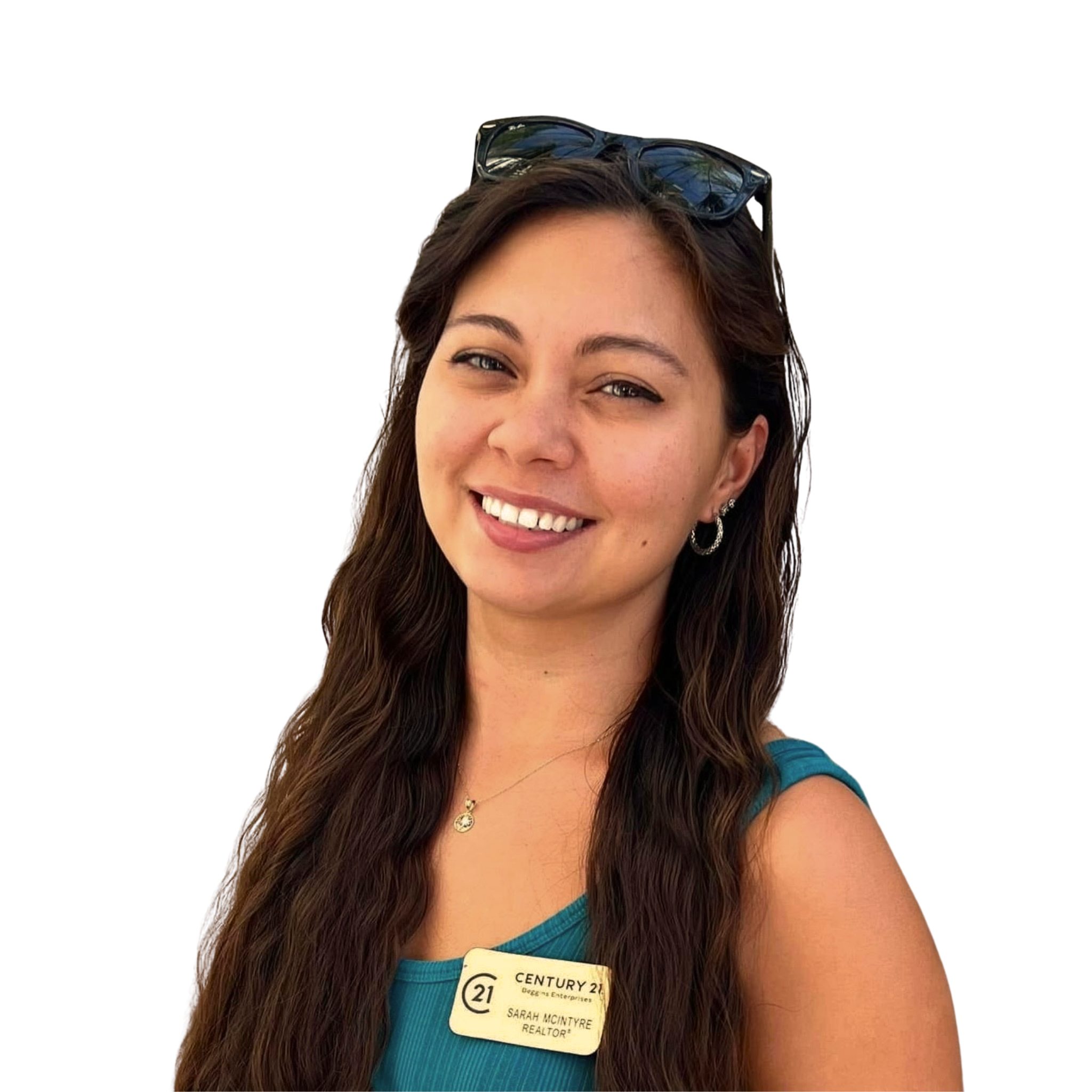 Sarah, REALTOR® serving Indian Rocks Beach, smiling in a professional headshot wearing a teal top and Century 21 name badge